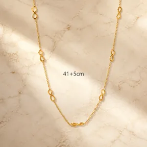 Detailed view of infinity figure-8 gold chain link necklace measuring 41cm with 5cm extension