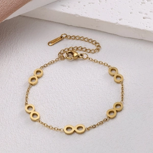 Macro detail of gold stainless steel infinity link bracelet with adjustable lobster clasp