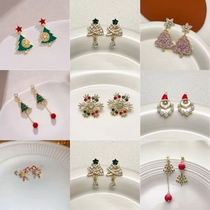 Macro shot of 9-pair Christmas earring set with Santa, trees, and snowflake charms