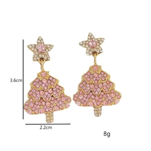 Detailed view of pink rhinestone Christmas tree earrings with size and weight marks
