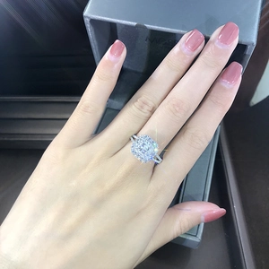 Luxury princess cut halo engagement ring with pavé diamonds in silver setting