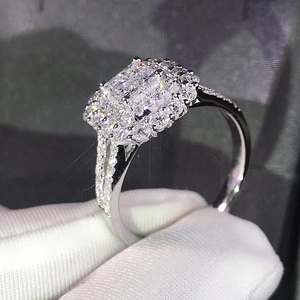 Classic silver-white engagement ring with micro-paved cubic zirconia in a rectangular halo