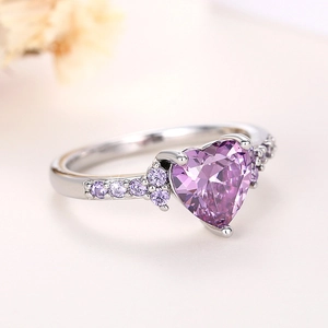 Detailed macro view of heart-shaped purple crystal ring with S925 silver micro-pave setting