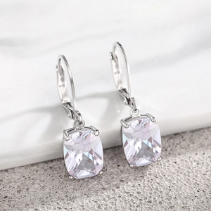 Close-up of elegant lever-back earrings with square cut clear cubic zirconia stones