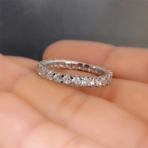 Close-up of sparkling full circle eternity ring with round brilliant cut cubic zirconia