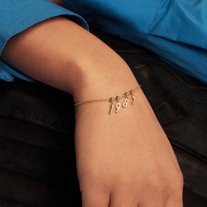 Adjustable gold 1989 birth year number bracelet set with sparkling cubic zirconia crystals