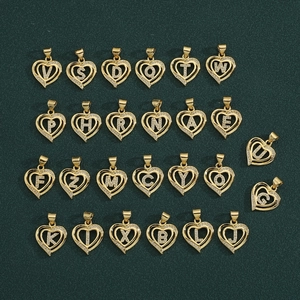 Detail of 26 gold heart-shaped pendants with micro-pave cubic zirconia letter accents