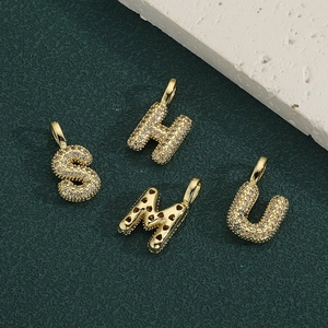 Pendentifs alphabet dorés S H M U sertis de pierres de zircone scintillantes