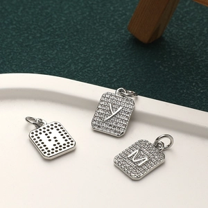 Silver square pendant featuring micro-set zircon initials with a honeycomb hollow back