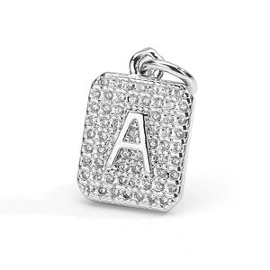 Macro detail of silver rectangular pendant with letter A and micro paved zircons