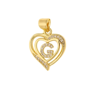 Detail of gold heart pendant with zircon letter G and S925 engraved stamp