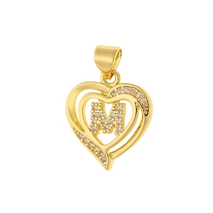Detailed macro view of heart-shaped gold pendant with micro-paved zircon letter M