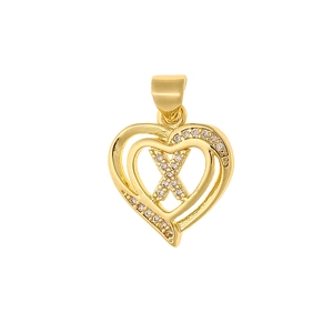 Macro detail of gold heart pendant with letter X and sparkling zircon inlay design