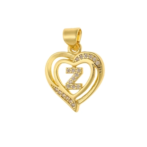 Close-up of gold heart pendant with cubic zirconia and letter Z engraving detail