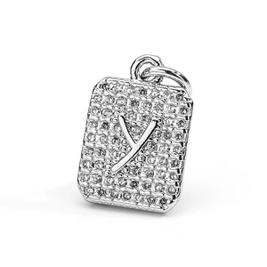 Detailed close-up of a silver-tone rectangular pendant with pave zircon and 3D letter Y