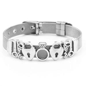 Silver mesh bracelet with heart locks, keys, and crystal charms on a white background