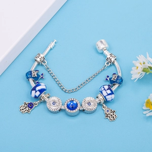 Bohemian alloy snake chain bracelet featuring blue crystal beads and Hamsa Hand charm