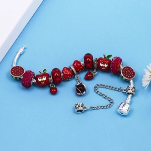 Silver snake chain bracelet with red crystal beads and apple strawberry charms