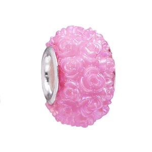 Macro shot of 3D pink resin rose charm bead with a metal core for DIY bracelet making