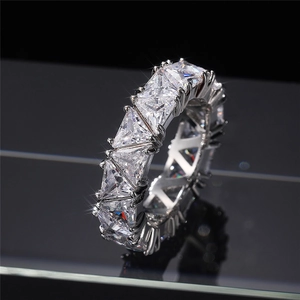 Macro detail of trillion cut cubic zirconia pavé setting on a silver eternity ring