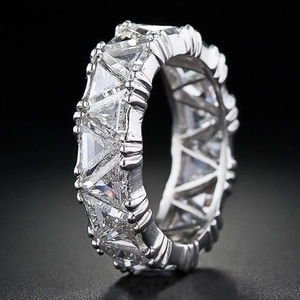 Macro side view of eternity band with triangle cut sparkling cubic zirconia in silver