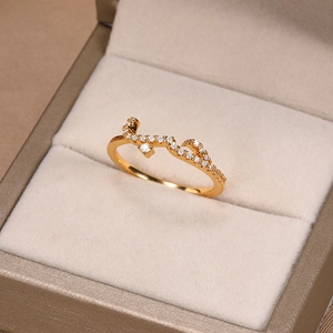 Close-up of rose gold Arabic necklace with zircons resting in a beige jewelry box