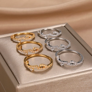 Detail of rose gold and silver Arabic Love necklaces with cubic zirconia in a jewelry box