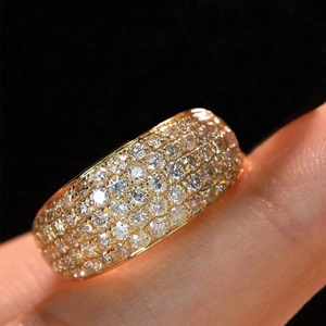 Luxurious gold-plated wide band ring featuring five rows of pavé-set shimmering zircons