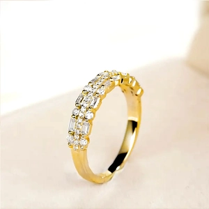 Detail of double-layer gold ring featuring alternating rectangular and round crystals