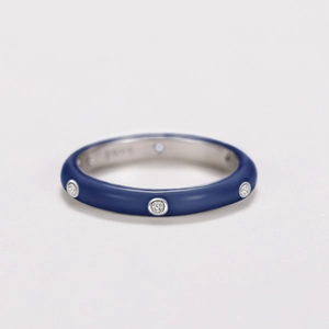 Detail shot of navy blue enamel ring with S925 silver engraving and zircon stones