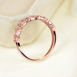 Macro shot of multi-layer rose gold eternity ring featuring sparkling pavé crystals