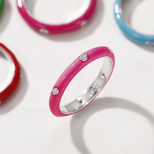 Macro shot of pink enamel ring with cubic zirconia stones showing vibrant color collection