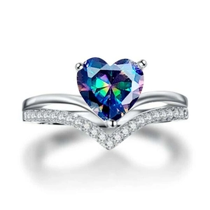 Macro detail of V-shaped silver ring featuring a heart-shaped mystical rainbow topaz stone