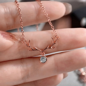 Rose gold reindeer antler necklace with a sparkling round zircon pendant on thin O-chain