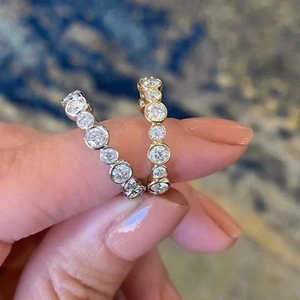 Elegant gold and silver bezel set eternity rings with round cut cubic zirconia for women