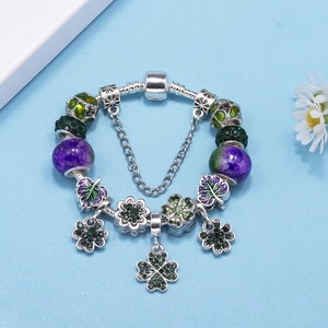 Silver-plated four-leaf clover charm bracelet with green crystal and purple glass beads