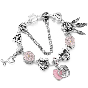 Pink enamel family tree charm bracelet with Mom heart pendants and dreamcatcher design