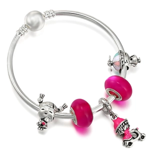 DIY charm bracelet with pink glass beads, skateboard girl pendant and large pearl clasp
