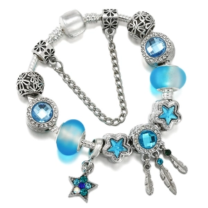 Silver snake chain bracelet with blue crystals, star charms and feather pendant