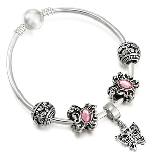 Silver charm bracelet featuring pink butterfly beads, a white pearl, and a butterfly pendant