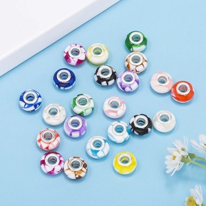 Macro shot of colorful gradient glass beads with silver metal core for DIY bracelets