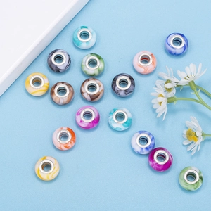 Macro detail of colorful marble texture resin beads with silver large hole metal core