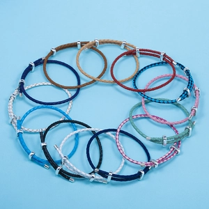 Adjustable braided leather bracelets in multiple colors with silver sliding metal clasps