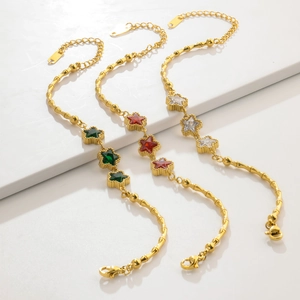 Golden bamboo link bracelets for women with colorful star-shaped gemstone accents