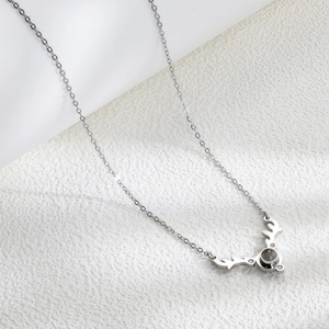 Silver-colored elk antler pendant necklace with sparkling stone on titanium steel chain