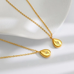 Vintage French gold-plated stainless steel teardrop necklace with starburst gem pendant