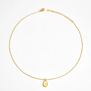 Gold plated waterdrop pendant necklace with eight-pointed star engraving on white background