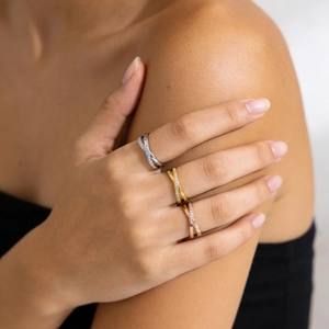 Crossed titanium steel rings in gold, silver and rose gold with micro-inlaid zircon stones
