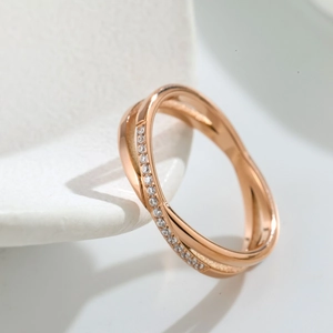 Rose gold crisscross titanium steel ring with micro-paved cubic zirconia stones