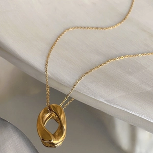 Minimalist 18k gold plated stainless steel necklace with twisted teardrop pendant detail